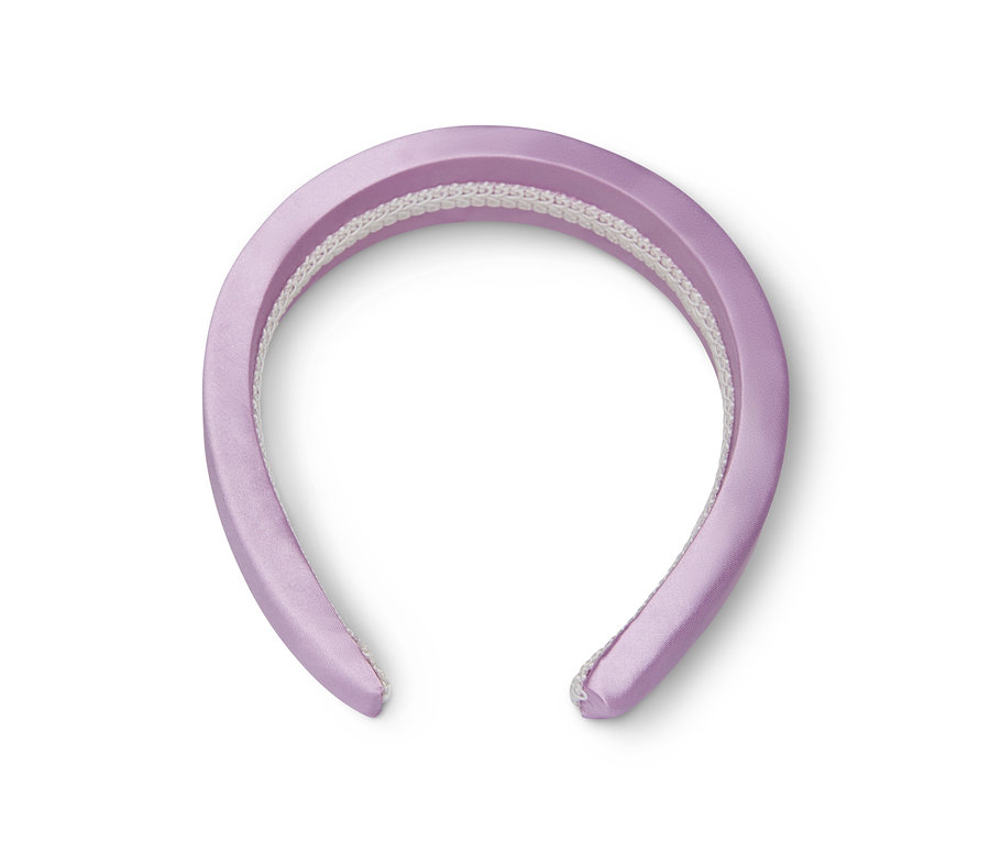 Fialová čelenka do vlasů na bílém pozadí.