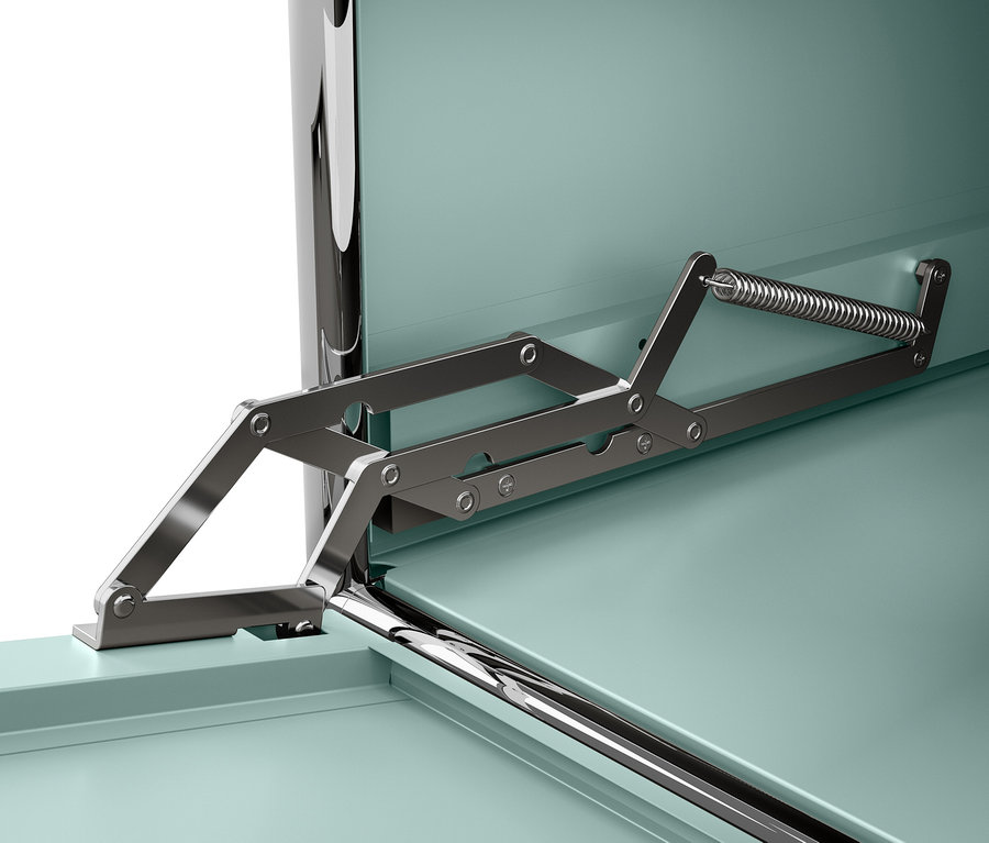 Detail kovového mechanismu s pružinou připevněného k tyrkysové skříňce.