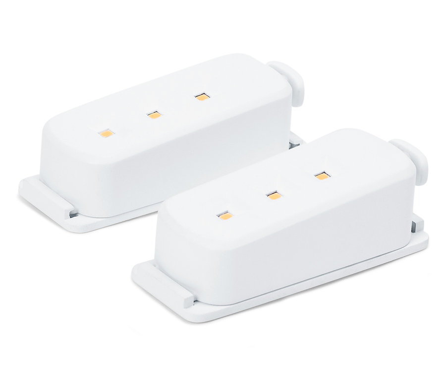 Dva bílé elektronické moduly s LED diodami na bílém pozadí.