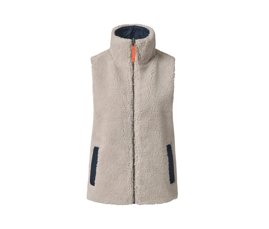 Béžová oboustranná vesta ve stylu oversized s oranžovým zipem a tmavě modrými detaily.