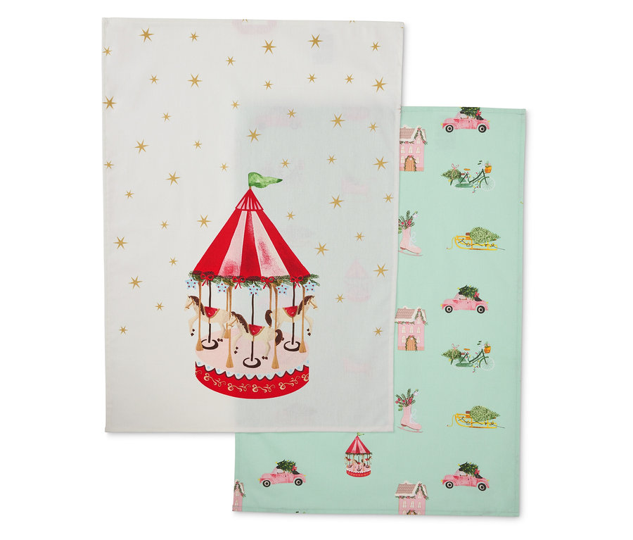 Dvě látkové utěrky: jedna s kolotočem, druhá se zimními motivy.