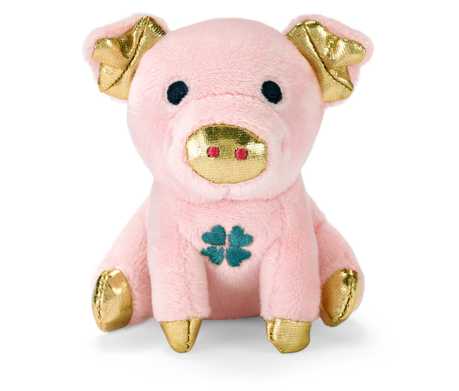 Růžové chrochtající prasátko pro štěstí se zlatými detaily sedí na bílém pozadí.