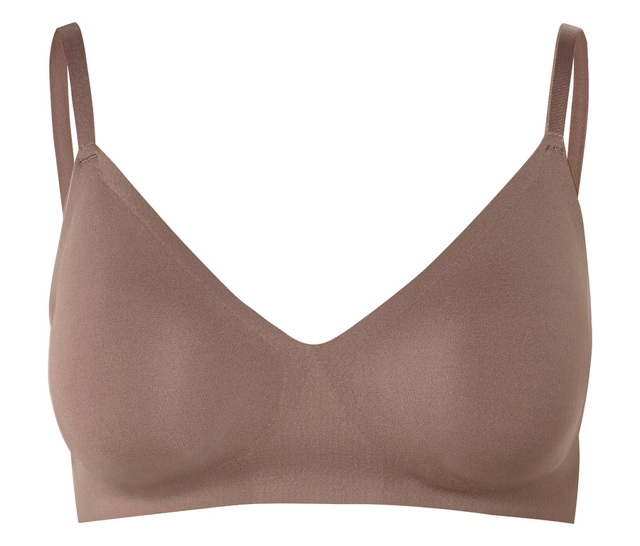 Tělová podprsenka s výstřihem do V a tenkými ramínky na bílém pozadí.