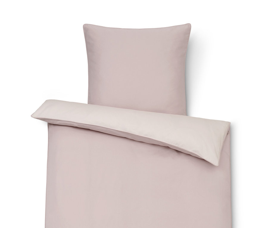 Růžové povlečení ze směsi bavlny a lyocellu TENCEL™ s polštářem.