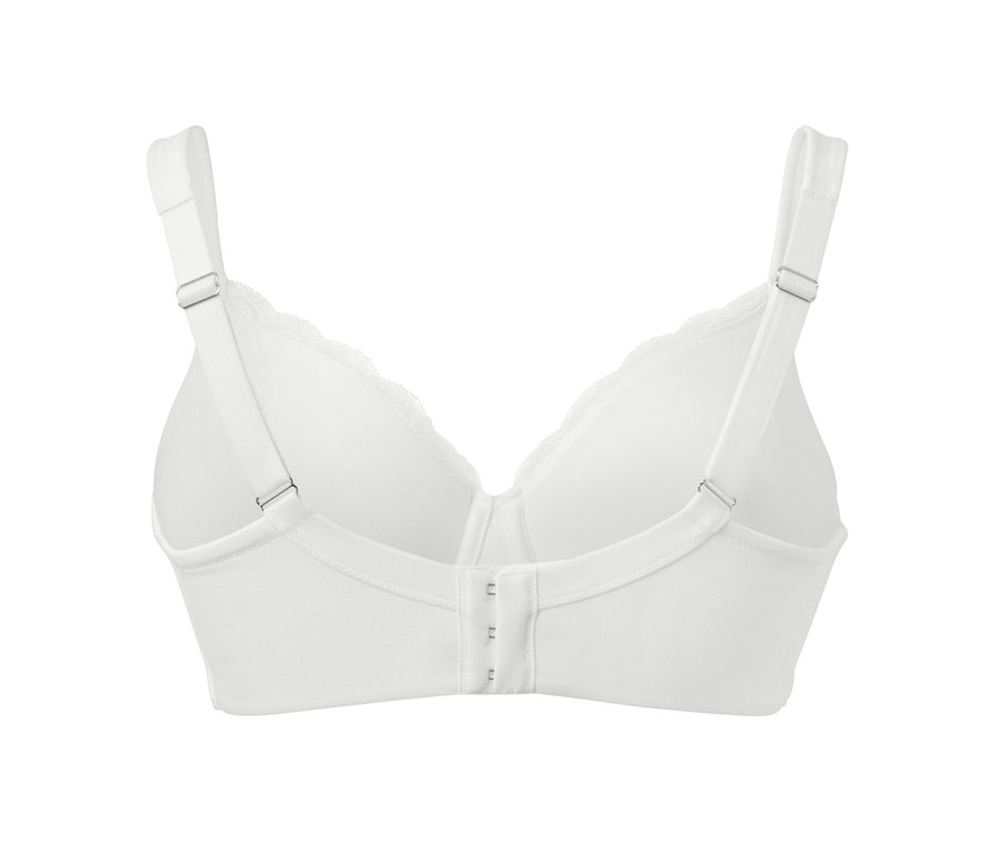 Detail bílé podprsenky s kosticemi zezadu.