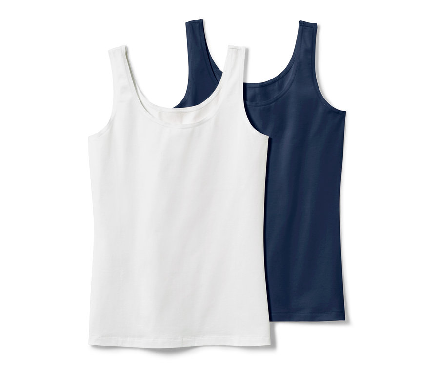 Dvě tílka, tmavě modré a bílé.