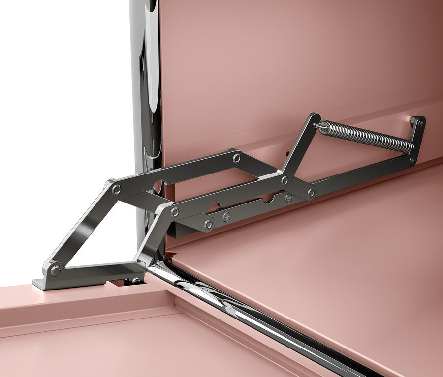 Detail mechanismu otevírání víka v interiéru nábytku s růžovými plochami.