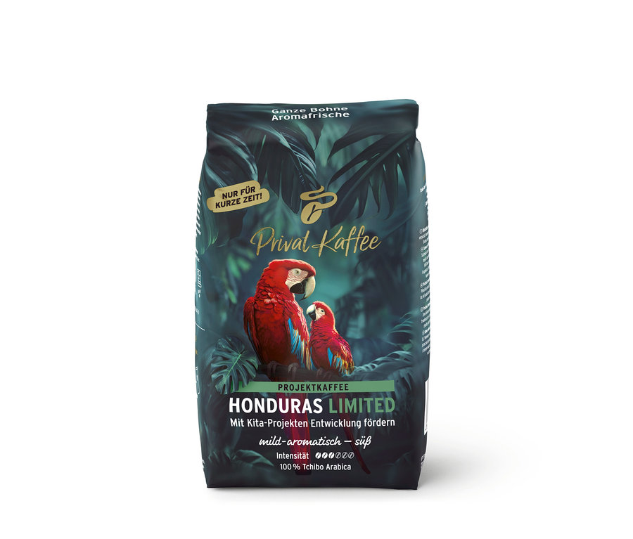 Tmavě zelené balení kávy Privat Kaffee Limited Edition Honduras s tropickým designem a dvěma červenými ary.