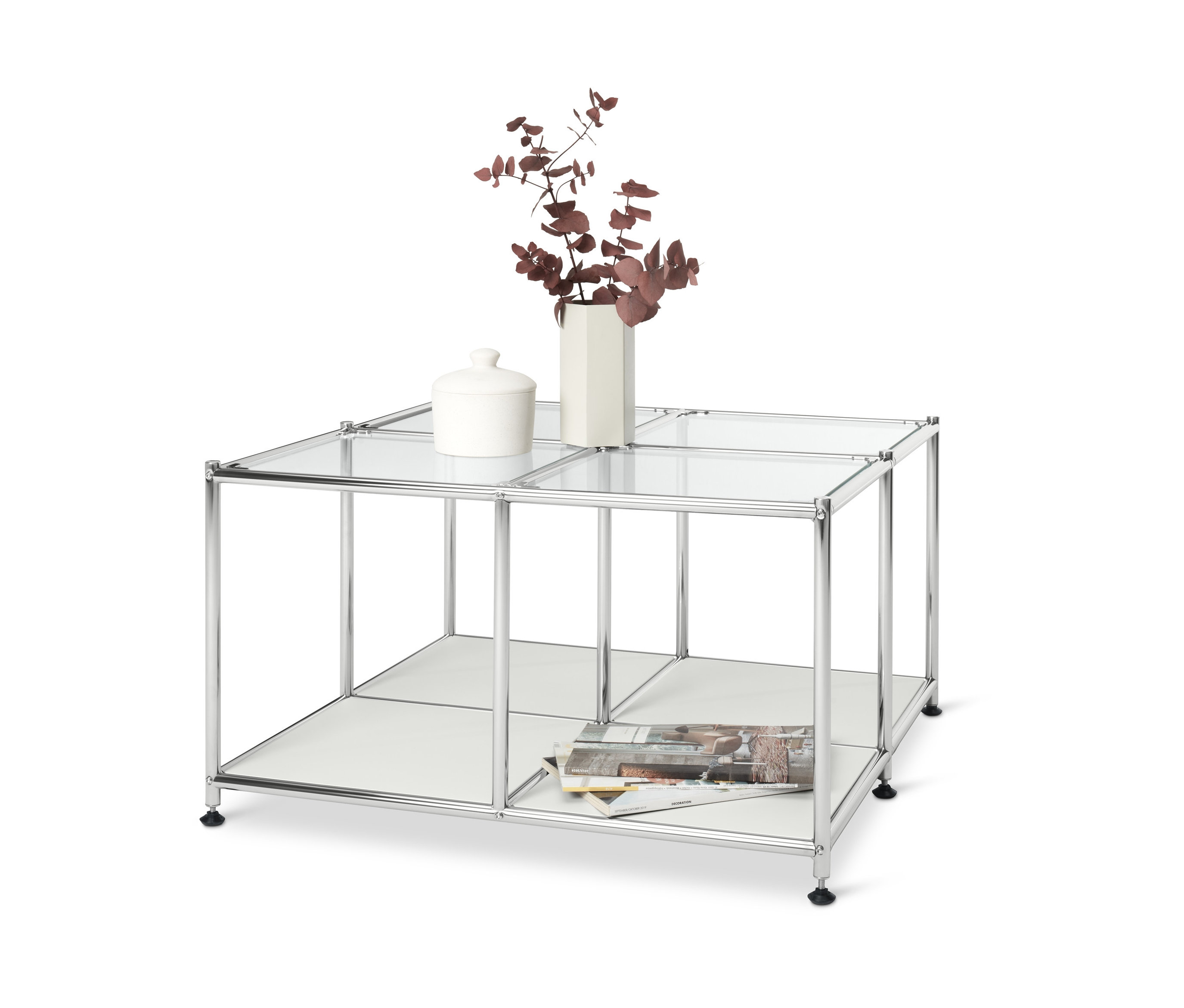 Bílý kovový konferenční stolek »CN3« se 4 skleněnými deskami. Na něm váza s rostlinami a keramická dóza.
