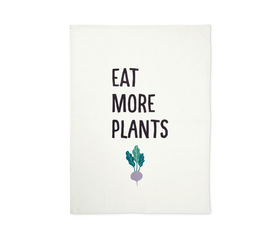 Bílá utěrka s nápisem EAT MORE PLANTS a obrázkem řepy.