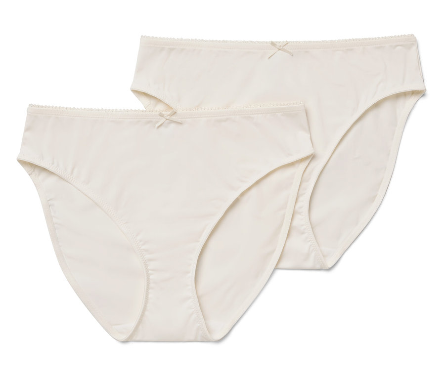 Dvoje dámské kalhotky smetanové barvy s mašličkou.