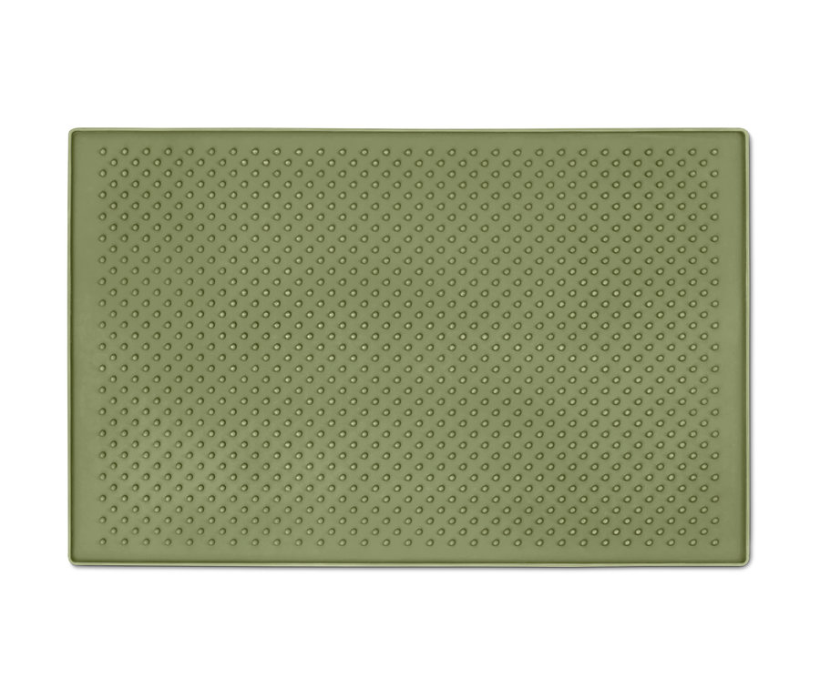 Zelená podložka pod misku na krmivo s texturou teček.