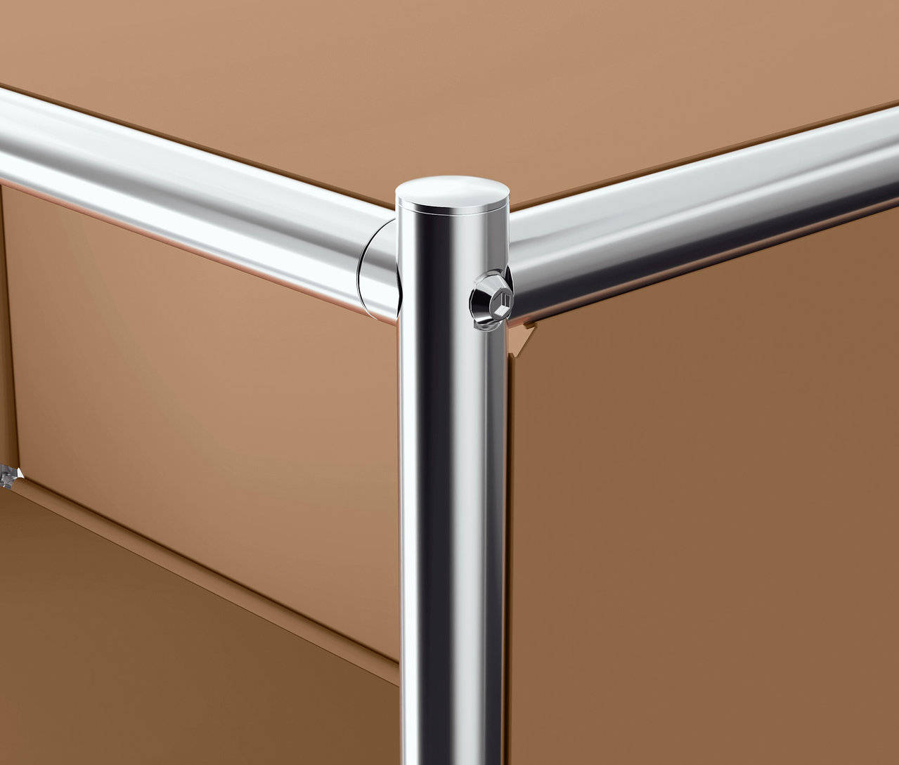 Detail rohu hnědého nábytku s chromovanou trubkovou konstrukcí.