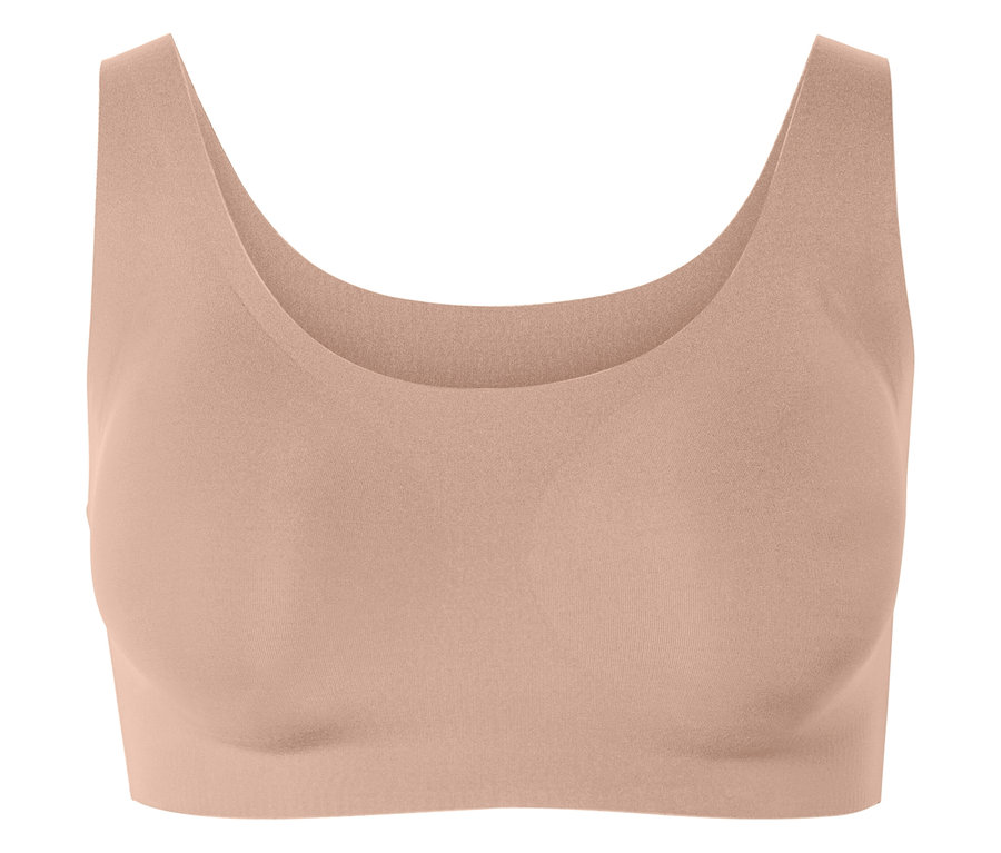 Sportovní podprsenka broskvové barvy.