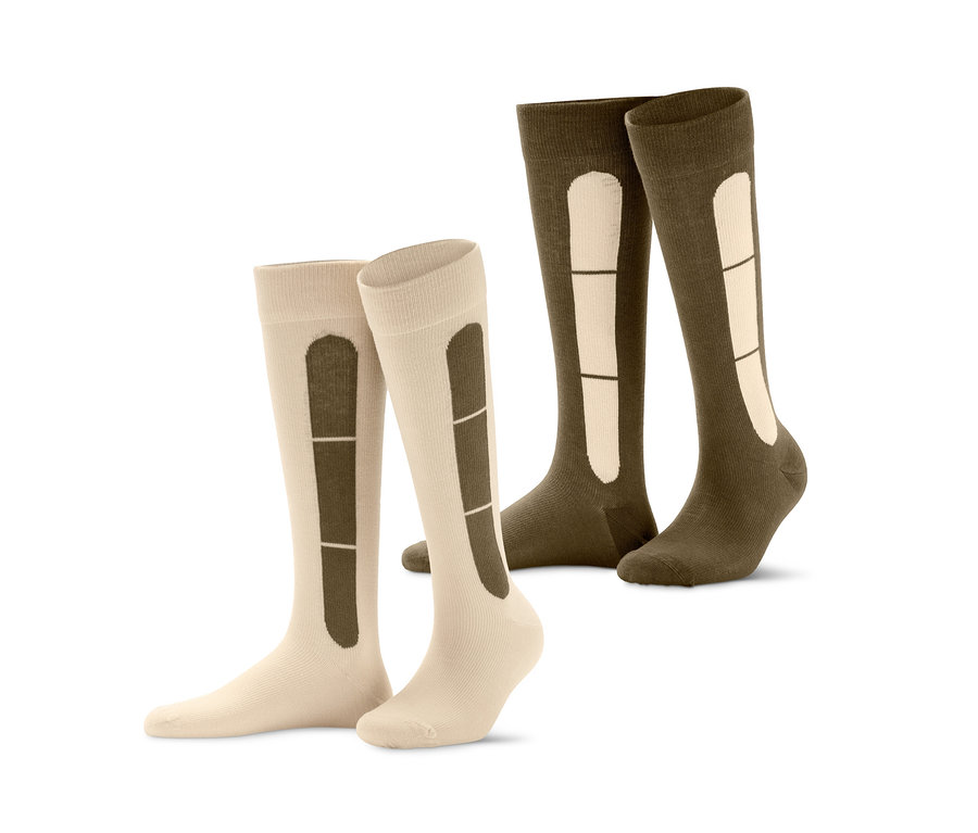 Dva páry cestovních kompresních punčoch v béžové a khaki barvě.