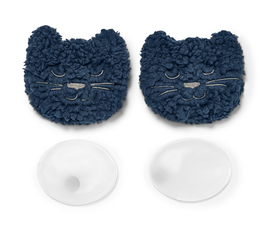 Dva hřejivé polštářky do kapsy »Kočka« s motivem kočky a dvě průhledné kulaté kapsle na bílém pozadí.