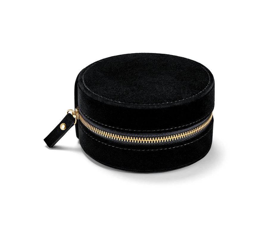 Černá kulatá malá šperkovnice se zlatým zipem.