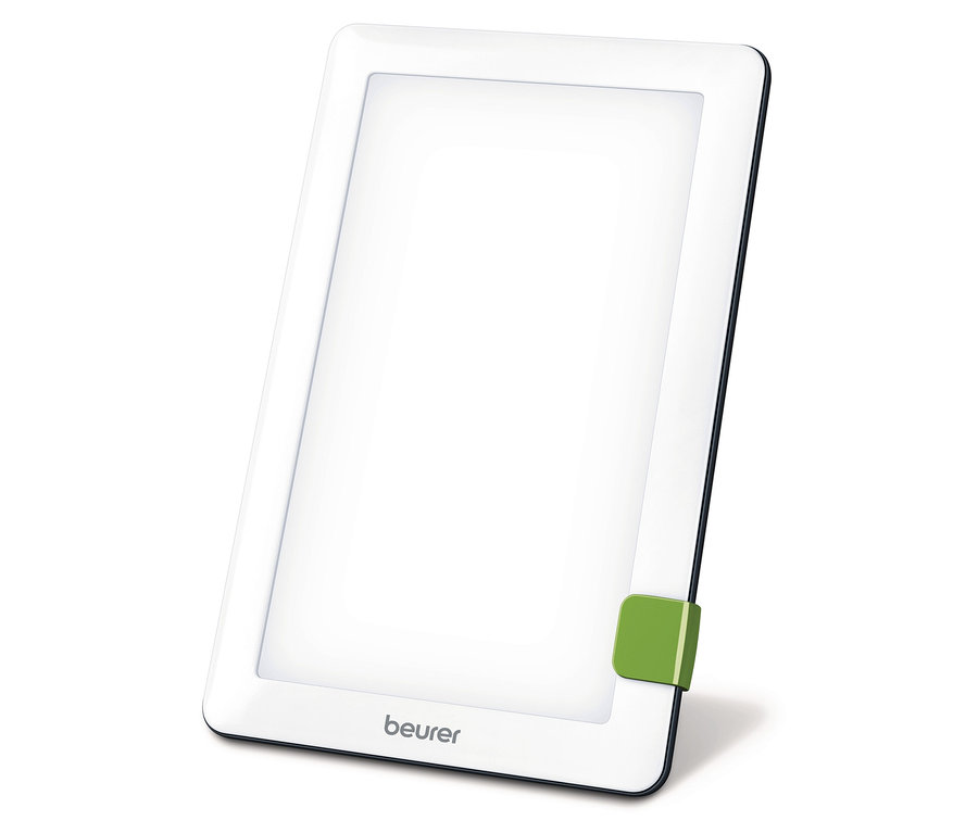 Světelná lampa Beurer se zeleným stojanem na bílém pozadí.