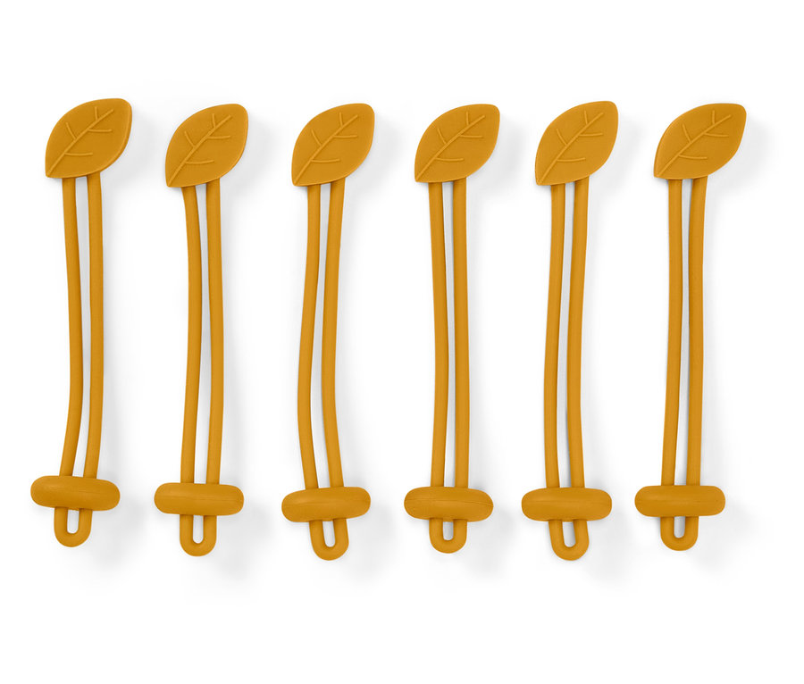 Šest žlutých silikonových držáků se vzorem listu nahoře a zapínáním ve tvaru písmene U dole na bílém pozadí.