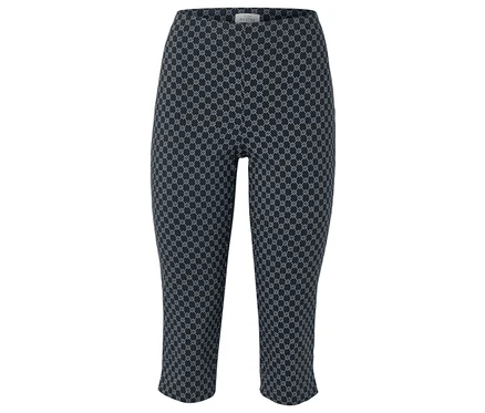 Tmavě modré Capri kalhoty s opakujícím se bílým geometrickým vzorem.