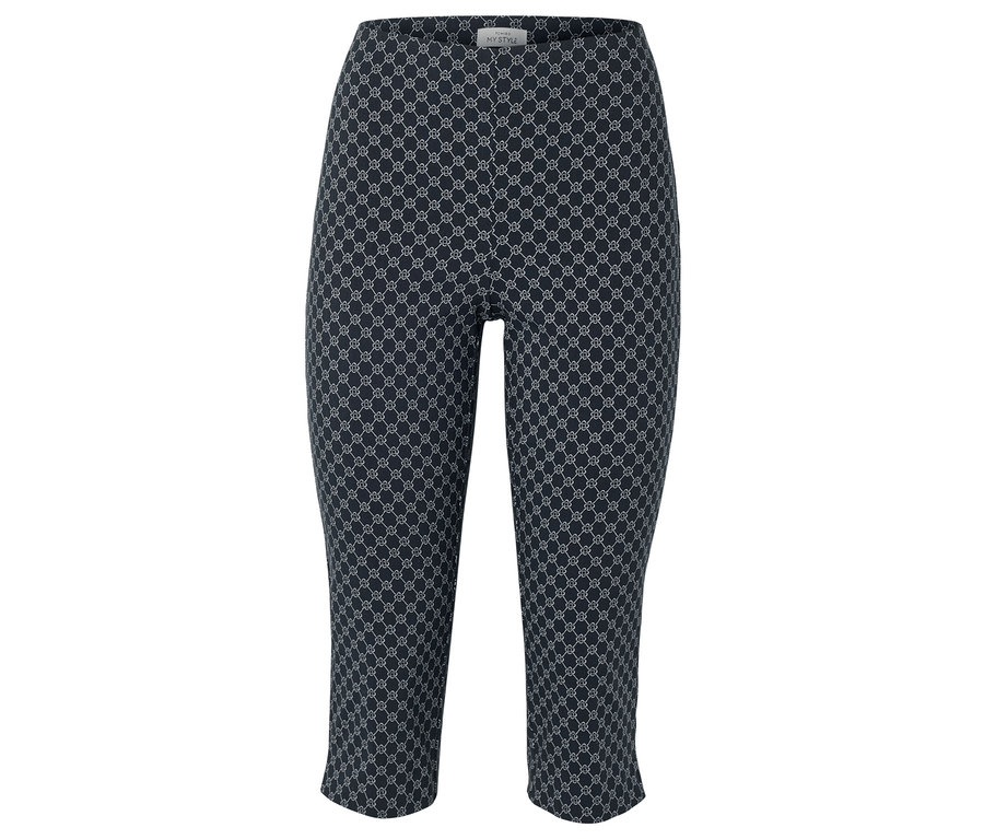 Tmavě modré Capri kalhoty s opakujícím se bílým geometrickým vzorem.