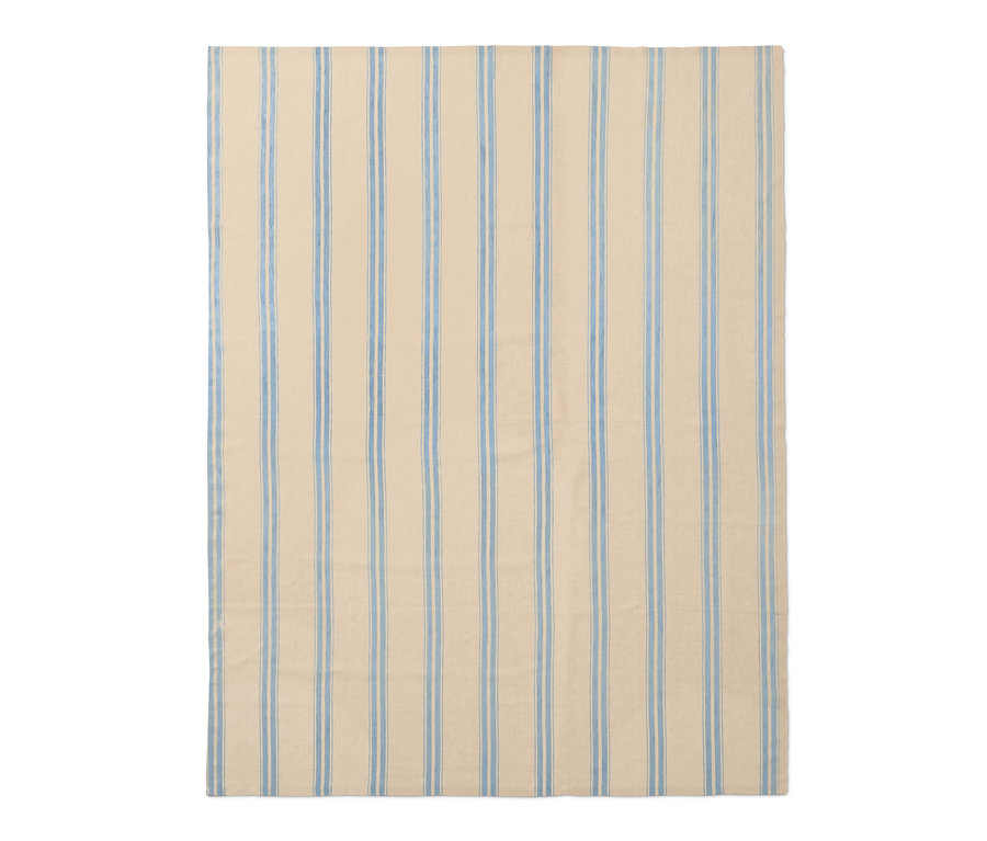 Béžový lněný ubrus s modrými proužky.