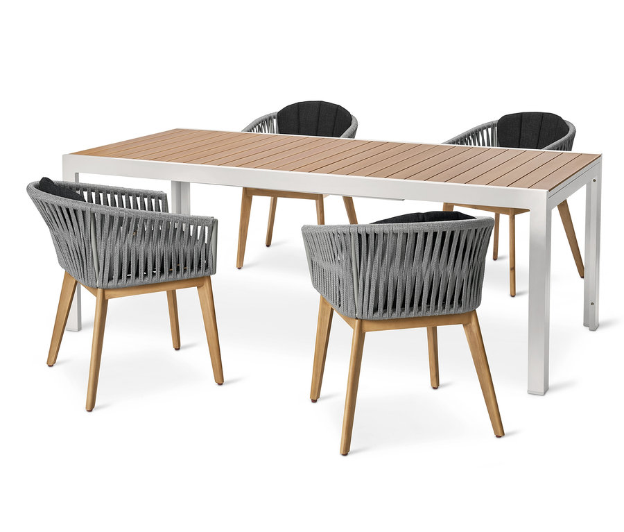 Čtyři křesla s textilním výpletem stojí kolem rozkládacího stolu Liska z lehkého hliníku.