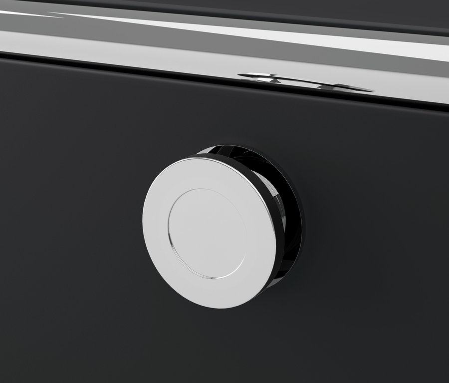 Detail černého kovového nábytku CN3 s kulatou stříbrnou rukojetí.