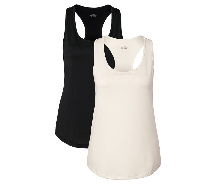 Dva tílka, jedno černé a jedno krémové, leží vedle sebe.