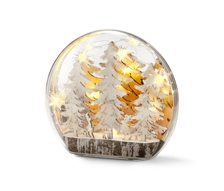 Dekorační koule s LED světly uvnitř zobrazuje zasněžené stromy a siluety zvířat.