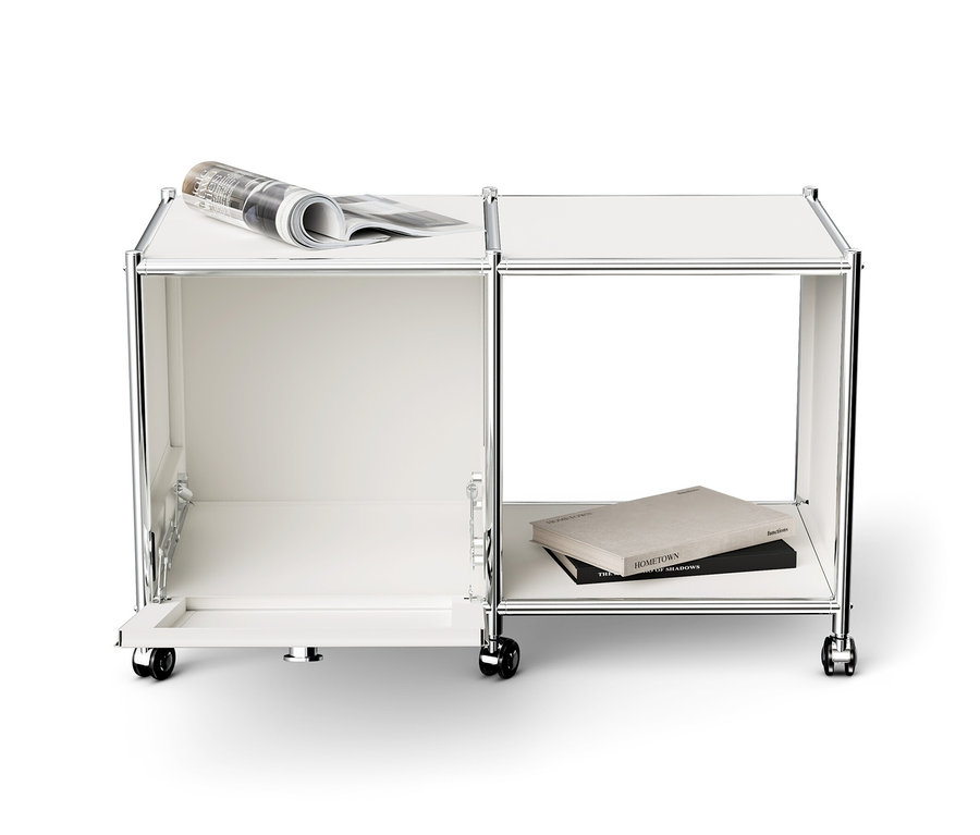 Bílý kovový odkládací stolek »CN3« s 1 výklopnými dvířky, kolečky a novinami nahoře.