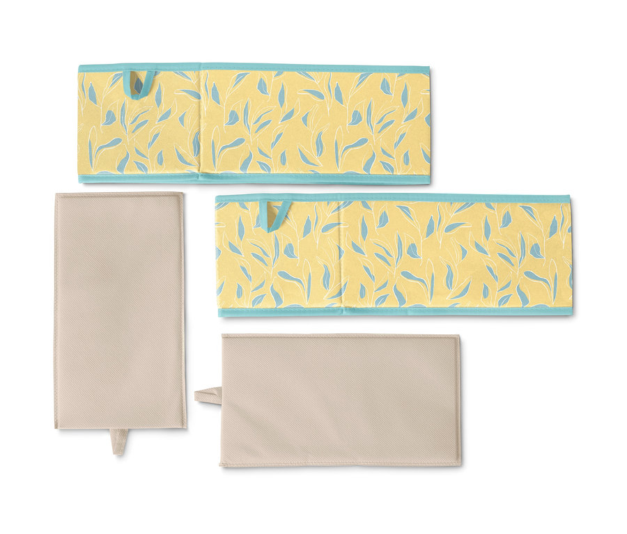 Dva střední úložné boxy do zásuvky, jeden béžový a jeden žlutý s modrými listy.