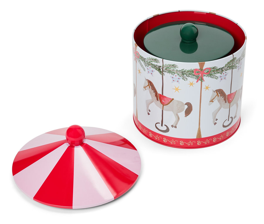 Otevřená plechová dóza s motivem koní a karuselu a víkem s červenými a bílými pruhy.