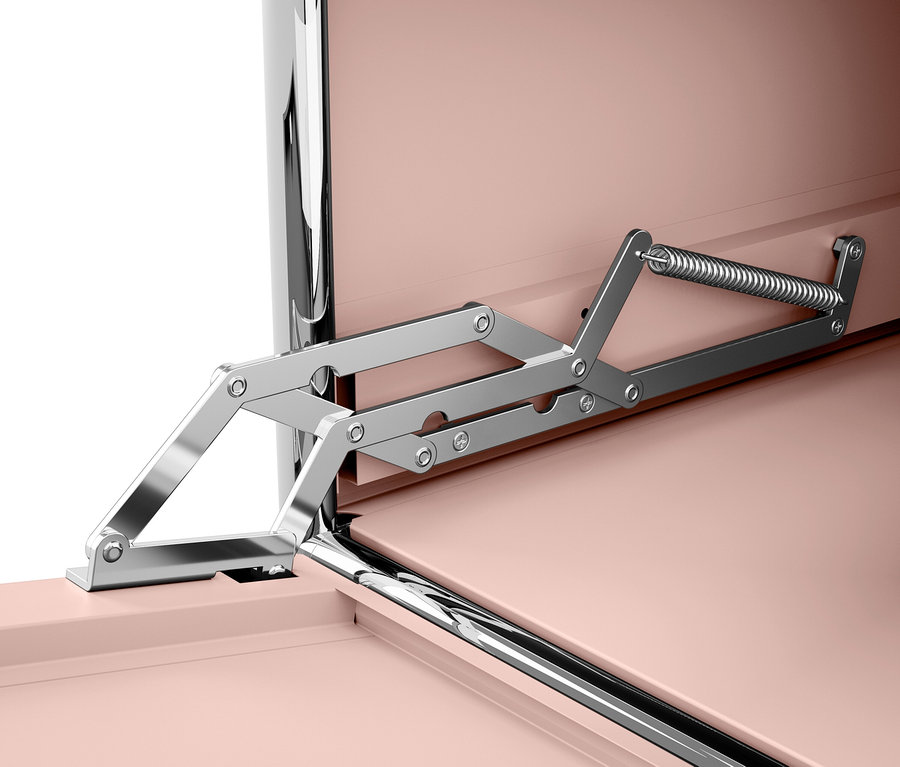 Detail otevíracího mechanismu růžové skříňky.