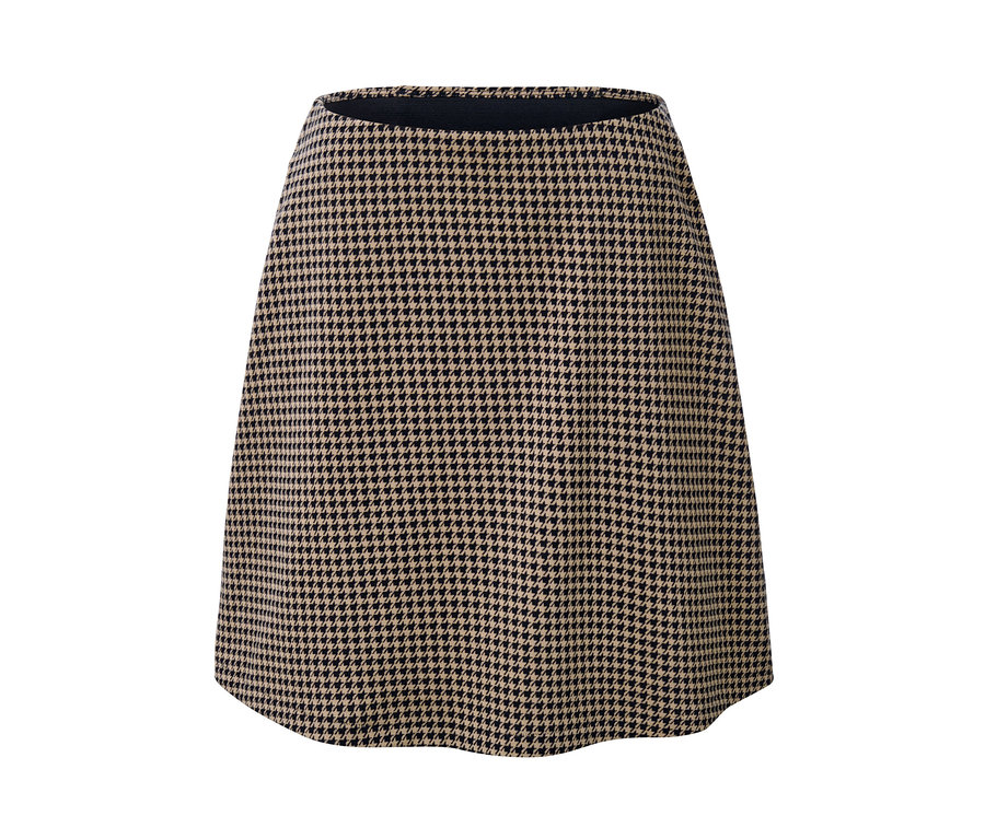 Detail teplákové sukně s žakárovým vzorem kohoutí stopy.