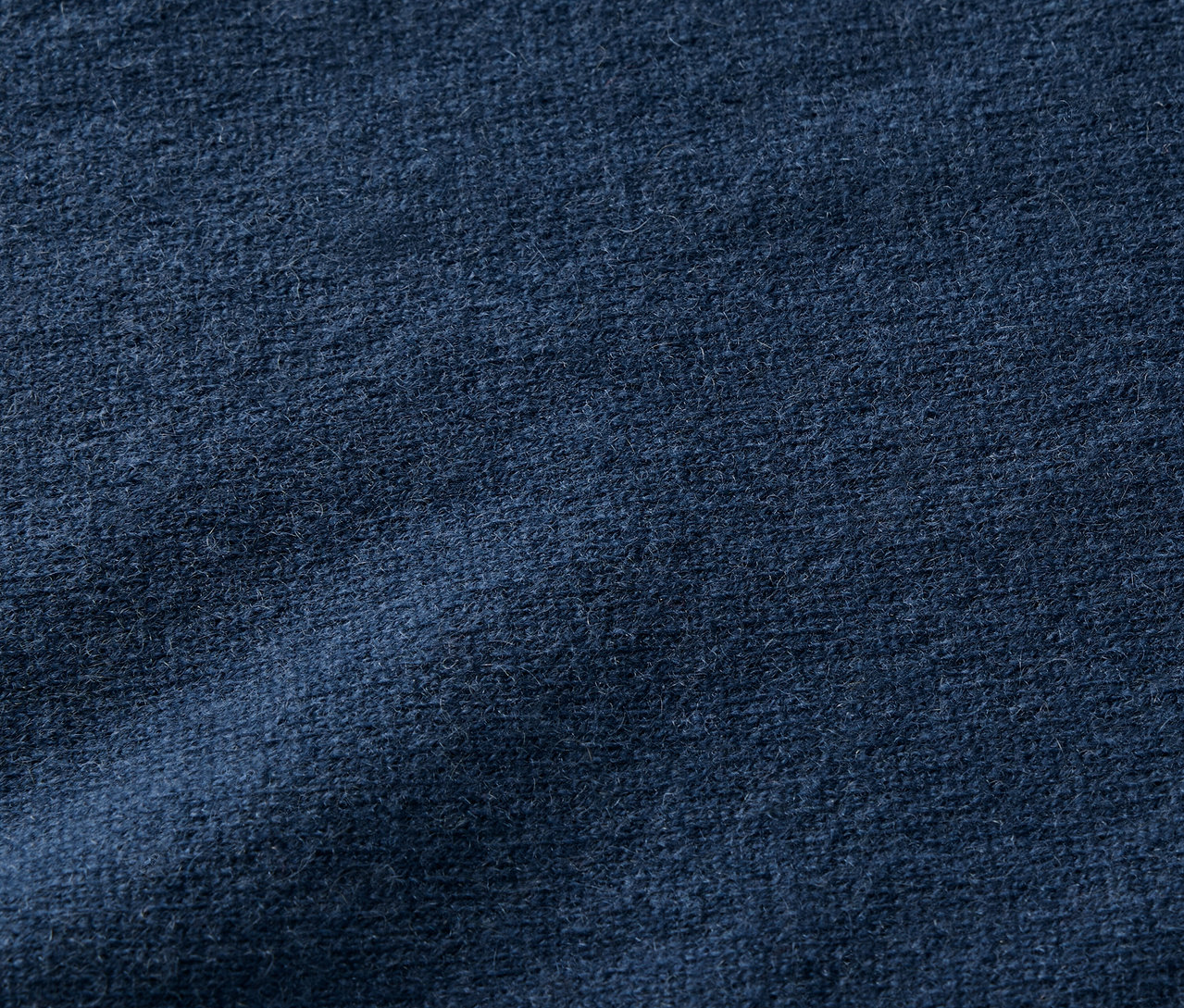 Textura tmavě modré látky.