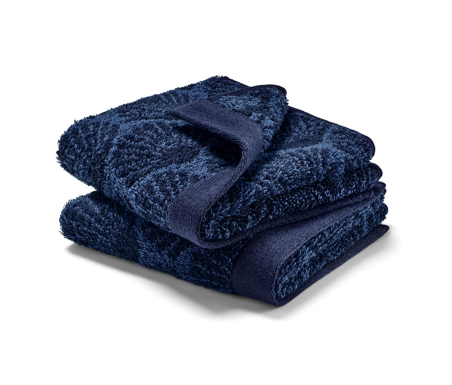 Složené dva ručníky pro hosty »Mušle«.