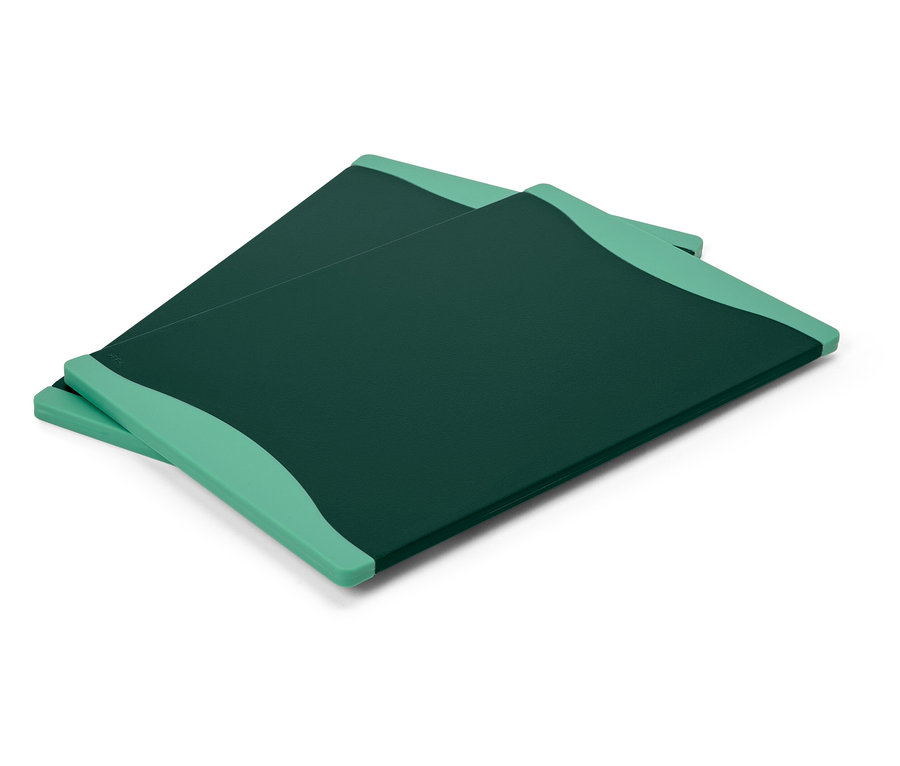 Dvě zelené desky na krájení leží na sobě.