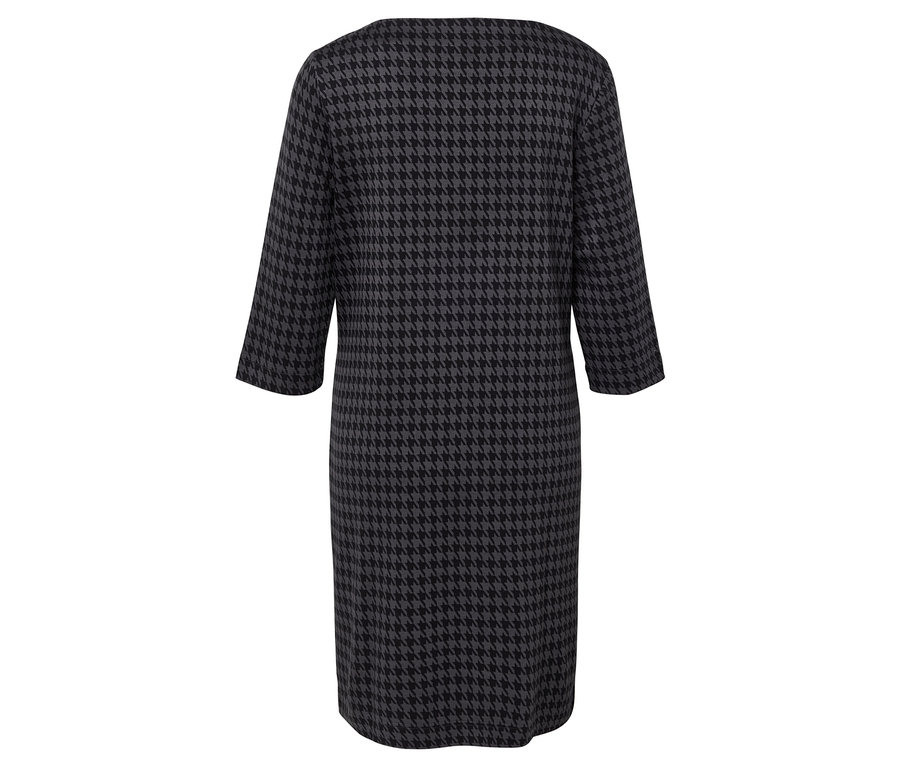 Zadní pohled na šaty s kohoutí stopou s tříčtvrtečními rukávy.