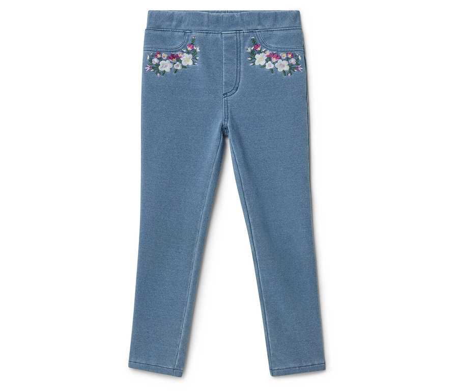 Světlé džínové kalhoty s květinovou výšivkou na kapsách.