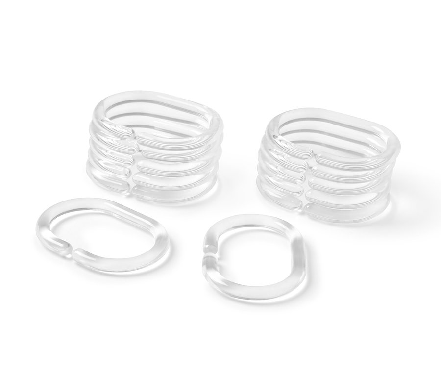 Dva stohy a dva jednotlivé háčky sprchového závěsu.