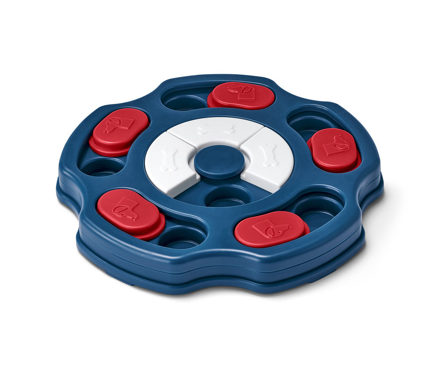 Interaktivní hračka pro psy má modrý kruhový podnos s červenými a bílými odnímatelnými prvky.