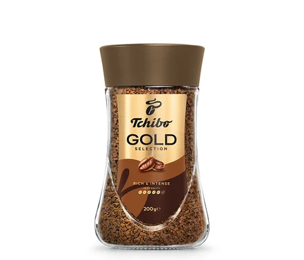 Sklenice instantní kávy Tchibo Gold Selection.
