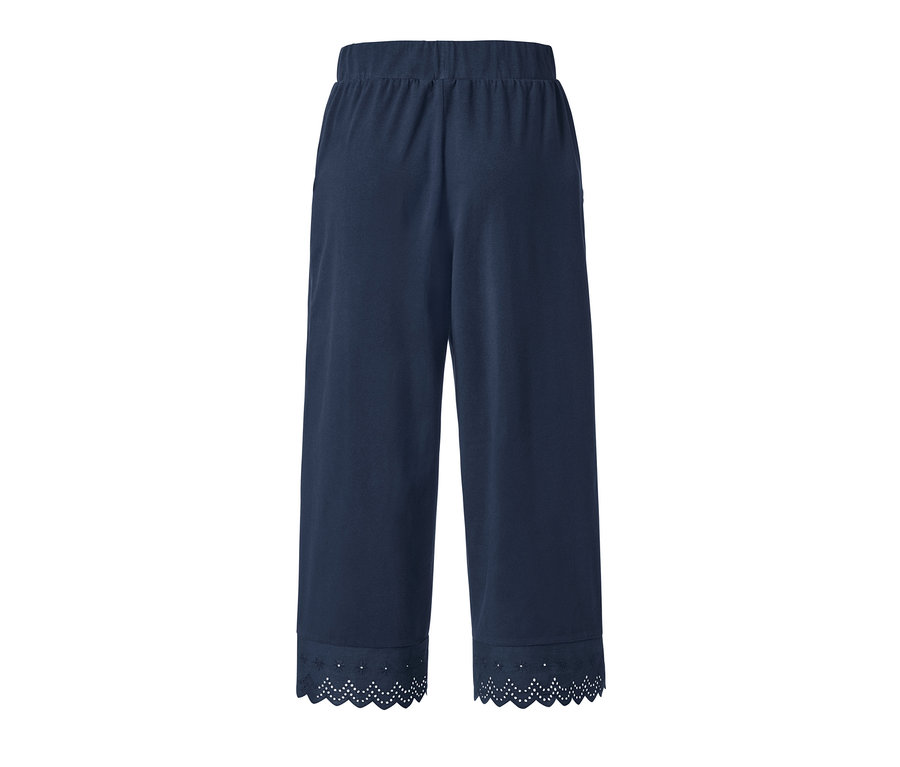 Tmavě modré culottes kalhoty s výšivkou na lemu.