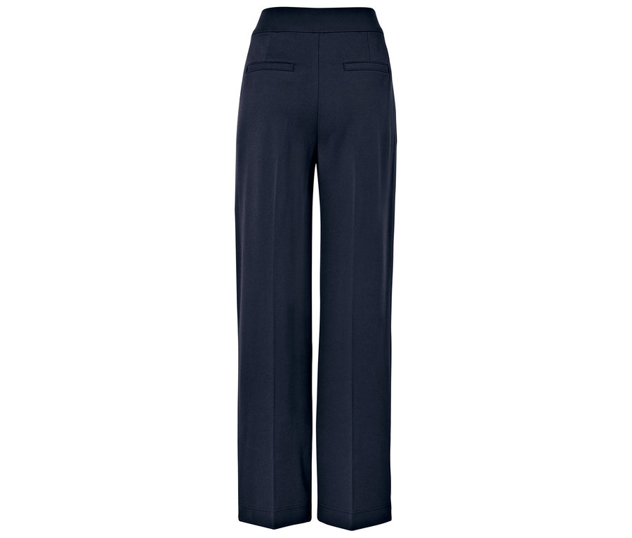 Tmavě modré široké kalhoty, pohled zezadu.