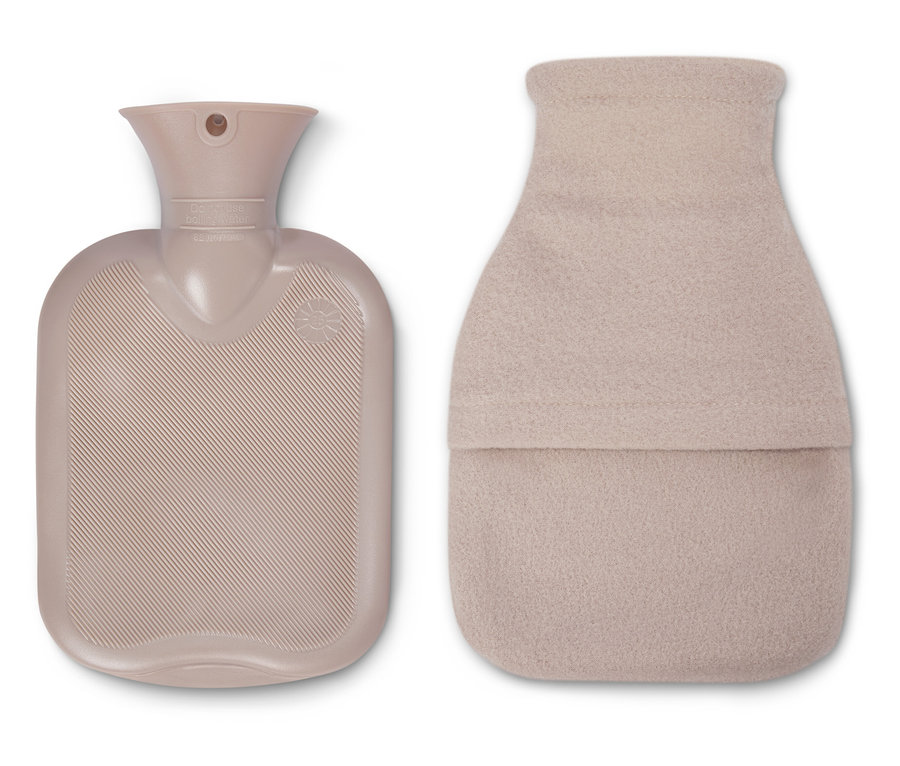 Béžové tělo termoforu leží vedle béžového termoforu s obalem.