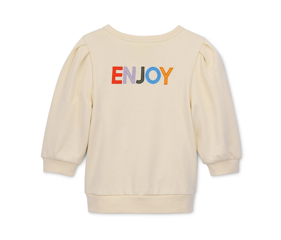 Krémová mikina zkráceného střihu s nápisem "ENJOY" v barvách duhy.