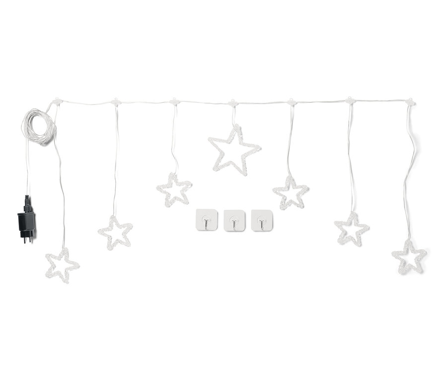 Bílý světelný řetěz s hvězdami a třemi držáky kabelů na bílém pozadí.