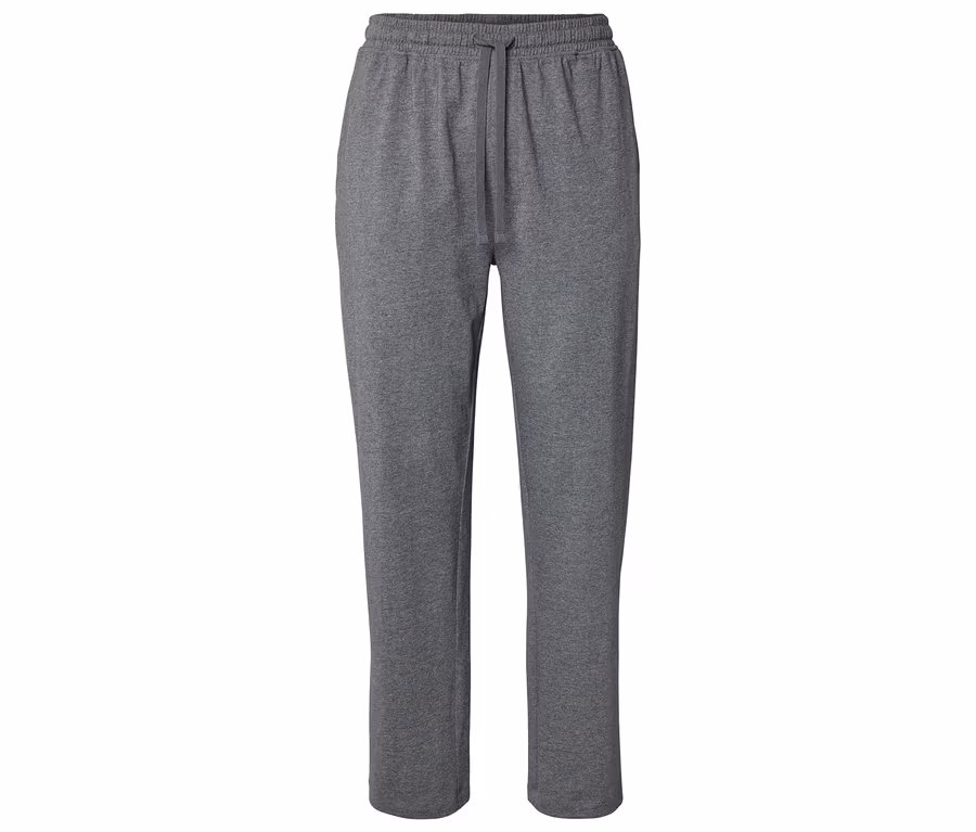 Šedé, dlouhé tepláky se stahovací šňůrkou, vyfocené zepředu.