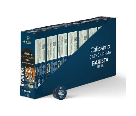 Tmavě modrý display box s 80 kávovými kapslemi Cafissimo BARISTA Caffè Crema India, vpředu jedna volná kapsle. Na krabici je hlava tygra.